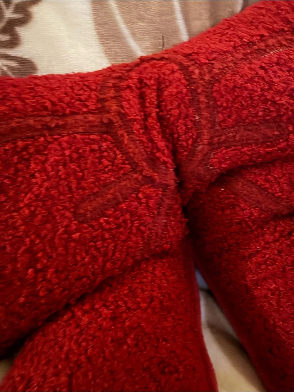 Burgundy bow-shaped cushion